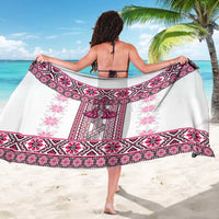 Pink folk patterned sarong with magenta border, worn as a wrap skirt by bare back