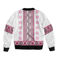 Pink folk patterned bomber jacket back view, ribbed black cuffs and hem