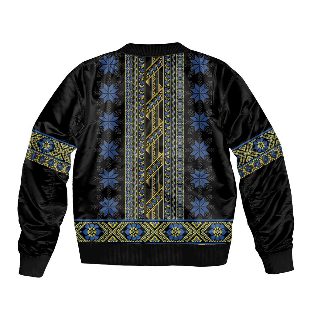 Black bomber jacket back with blue and yellow folk striped embroidery and ribbed hem