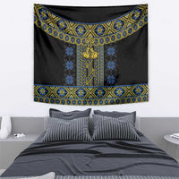 Black folk tapestry featuring blue and gold geometric bands and ornate central motif