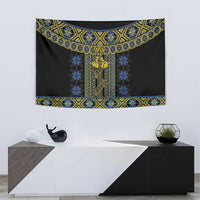 Rectangular wall tapestry in black with blue snowflake pattern and gold center emblem