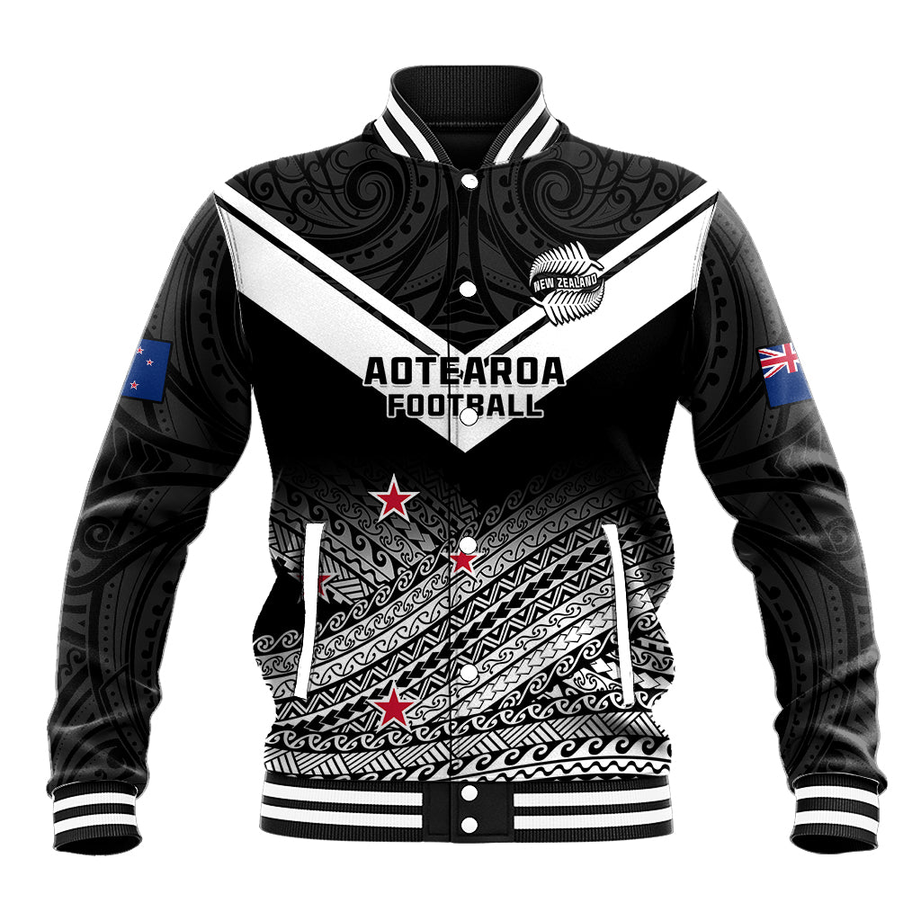 Unisex black baseball jacket with Maori fern pattern, snap front and ribbed cuffs