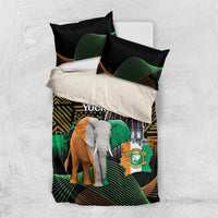 Black bedding set with elephant print, gold tribal lines, and green wave accents