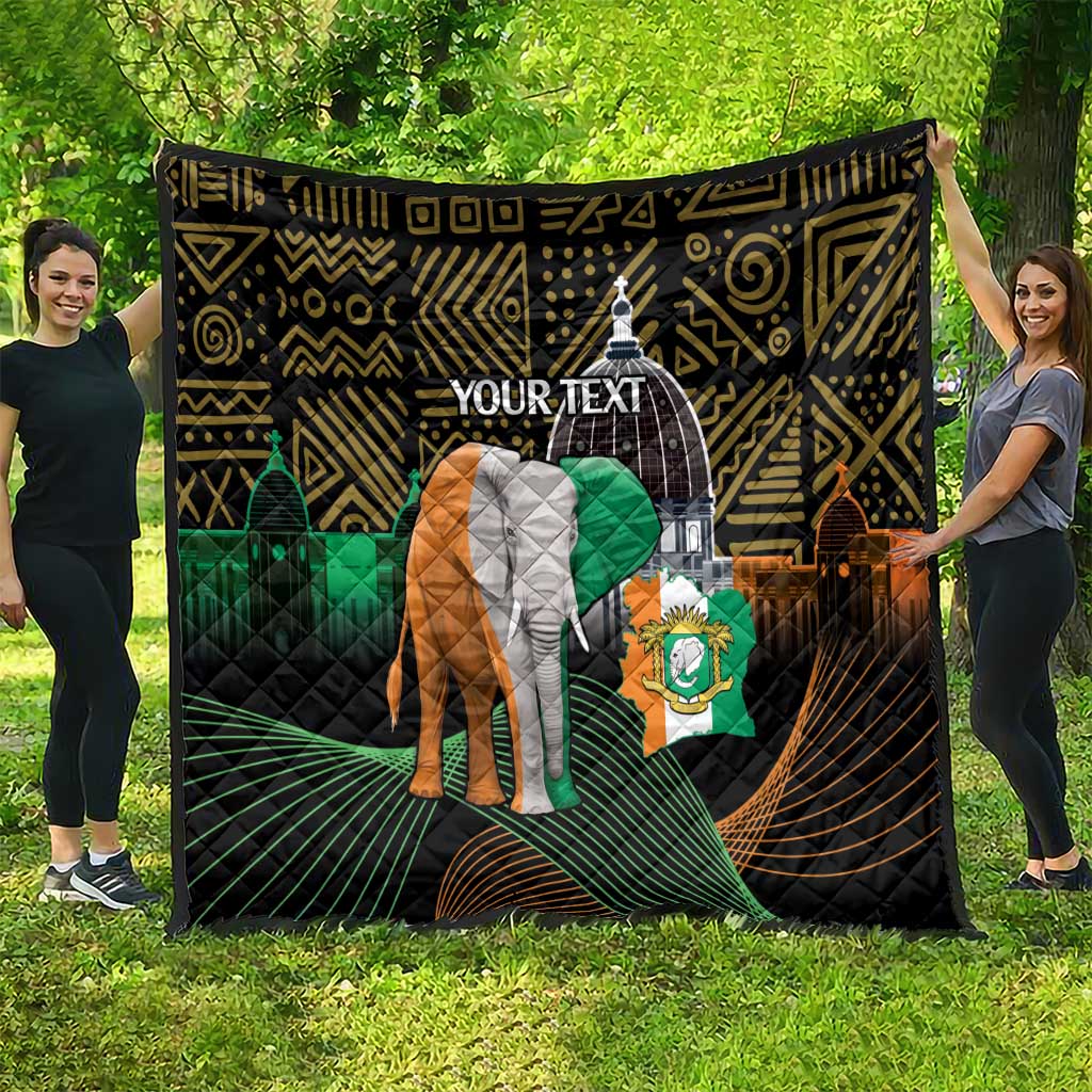 Personalized quilt spread on grass with elephant and green flag on black geometric design