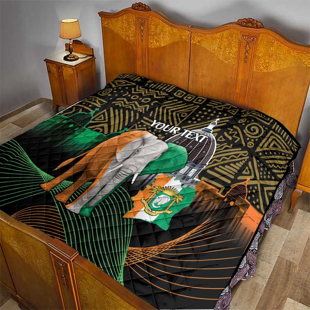 Personalized quilt on bed with elephant and green flag on black geometric African pattern