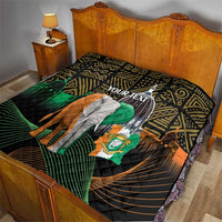Personalized quilt on bed with elephant and green flag on black geometric African pattern
