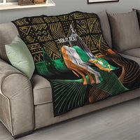 Personalized quilt on gray sofa with elephant and green flag on black geometric African pattern