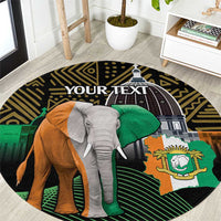 Round African design rug featuring elephant, green flag, and crest emblem over dark border