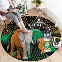 Round patterned carpet with elephant portrait graphic, green flag, and crest emblem in dark colors