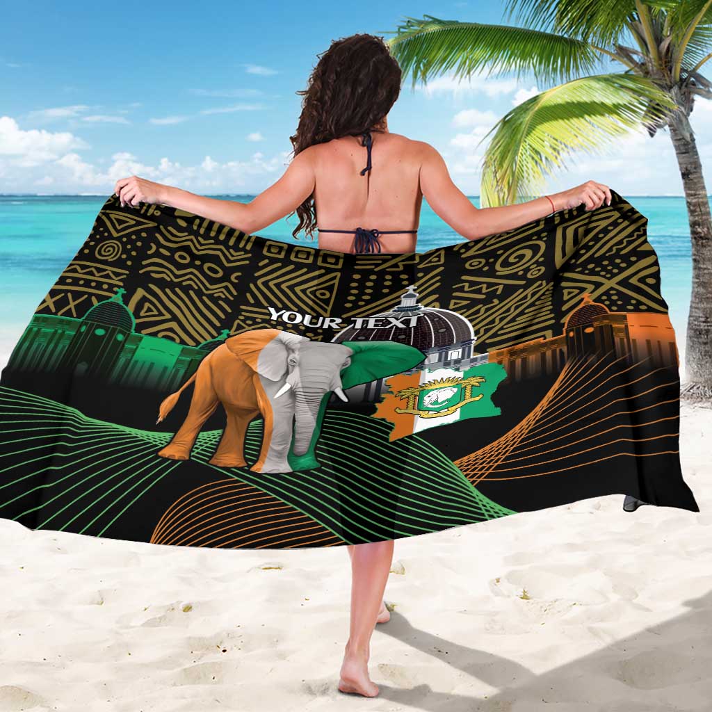 Black patterned sarong with “YOUR TEXT” and elephant print, draped on back