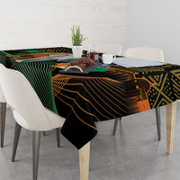 Dining tablecloth in black with green and gold patterned bands and elephant emblem scene