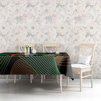 Black tablecloth with green and gold geometric lines and elephant motif on dining set