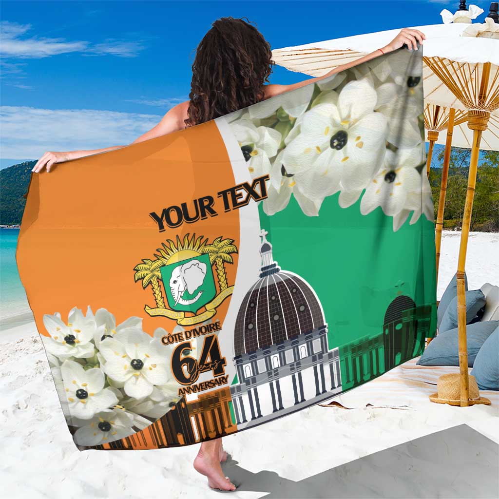 Personalized sarong with floral print, green and orange panels, and skyline emblem