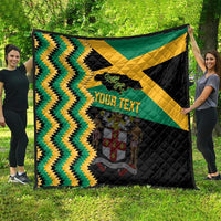 Custom Jamaica football quilt laid flat outdoors with green/yellow chevrons, black blocks, star, your text