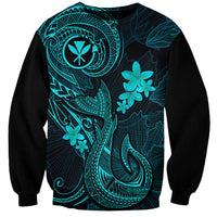 Black sweatshirt with turquoise Polynesian tattoo fishhook and plumeria floral graphic