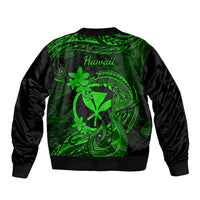 Green bomber jacket with black sleeves, back print with Hawaiian text and tattoo plumeria