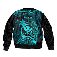 Turquoise bomber jacket with back Hawaiian text and tropical flower and leaf design