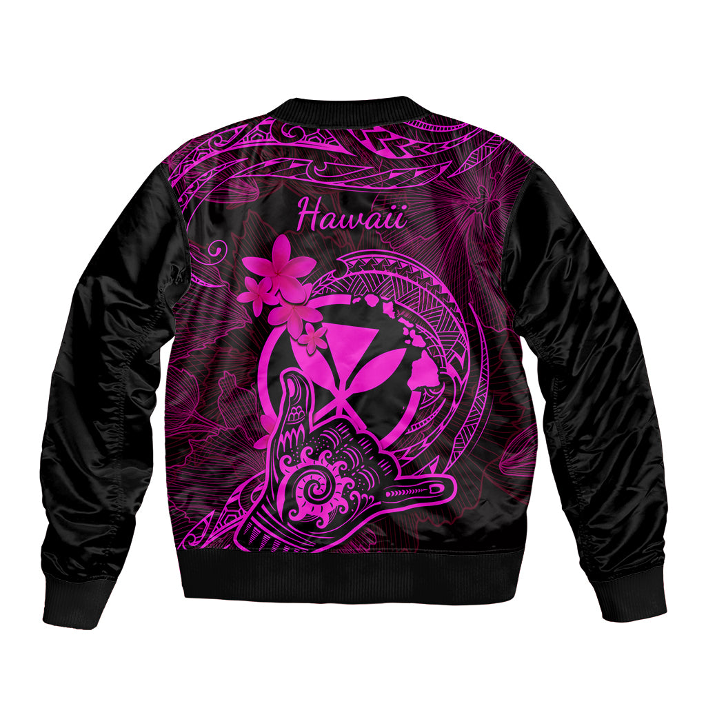 Black bomber jacket with back graphic reading Hawaii and tribal circle plus flowers
