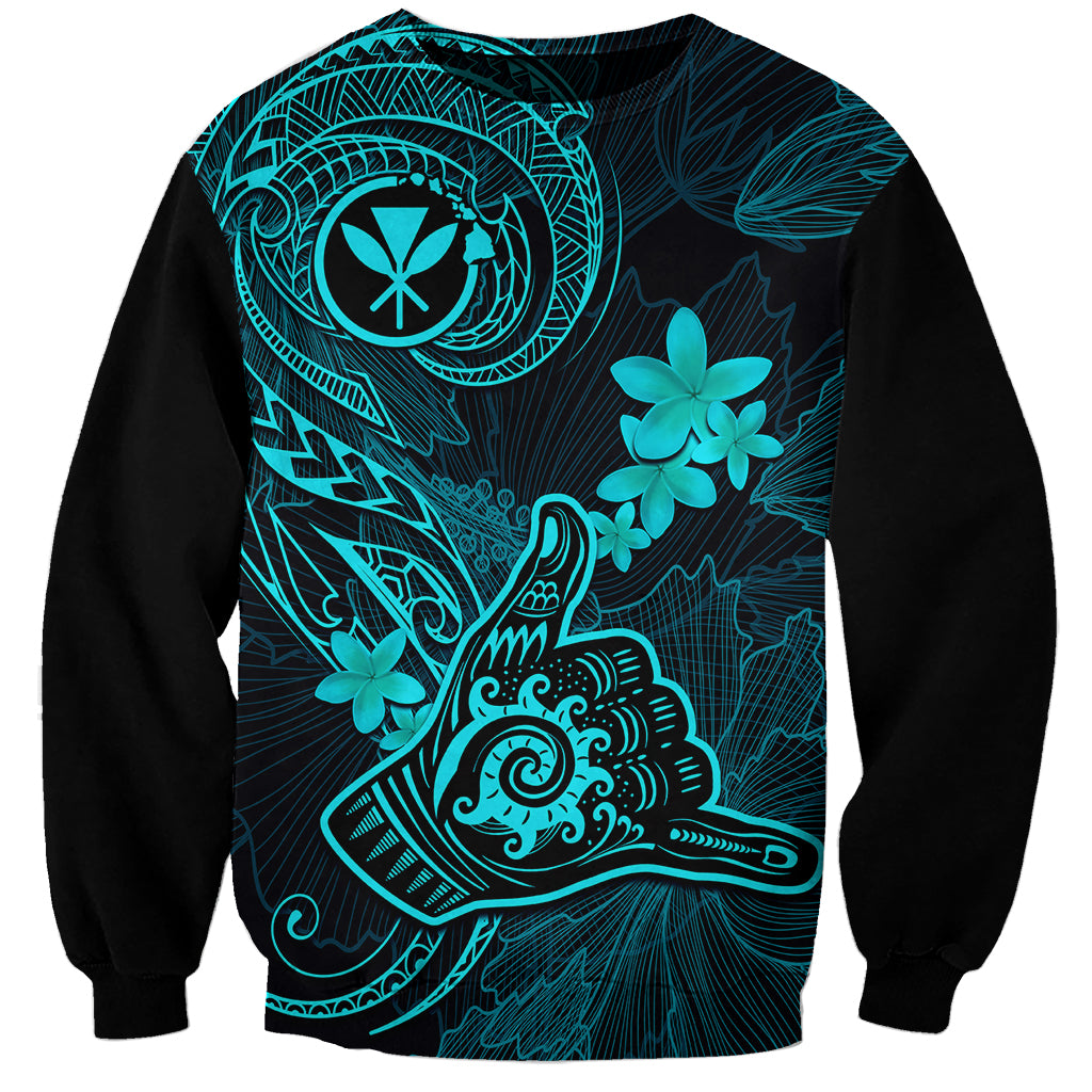 Black sweatshirt with turquoise Polynesian tattoo-style Shaka and plumeria graphic