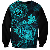 Turquoise and black crewneck sweatshirt with tropical bird and floral graphic