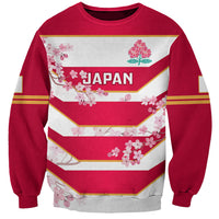Red sweatshirt with Japan graphic, cherry blossoms, and striped chevron design