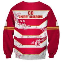 Red sweatshirt back with Go Cherry Blossoms text and cherry blossom striped graphic