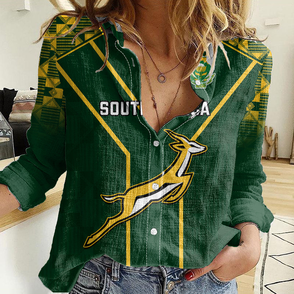 Women’s green casual shirt with yellow geometric stripes and button front, chest logo