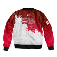Red bomber jacket back with white rose pattern and 'Come on England' text, black ribbing