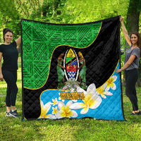 Quilt outdoors: green top panel, black center, blue bottom with shield design and flowers