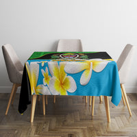 Blue tablecloth with white-and-yellow flowers and a green-and-black decorative top panel