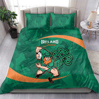 Green bedding set on a bed: Ireland Sevens mascot and shamrock graphic with orange stripe.