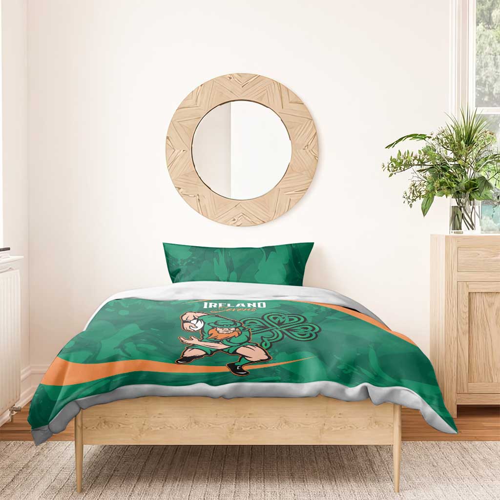 Green bedding set with Ireland Sevens logo and rugby mascot, orange band, on a wooden bed.