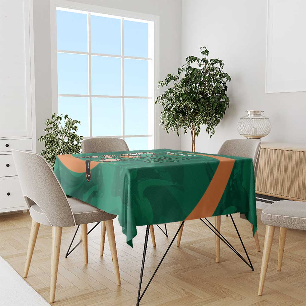 Green Ireland Rugby Sevens tablecloth with Irish shamrock design over dining table