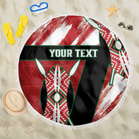 Round beach blanket with red, white, green African pattern, fringed edge, custom text