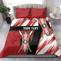 Red, white, and black bedding set with “YOUR TEXT” shield design and two matching pillowcases