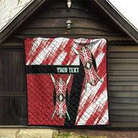 Red and white quilt with tribal emblem figures, black band, and "Your Text" centered.