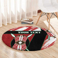 Round area rug with red/white brushstroke rim, green-and-black emblem, 'YOUR TEXT'