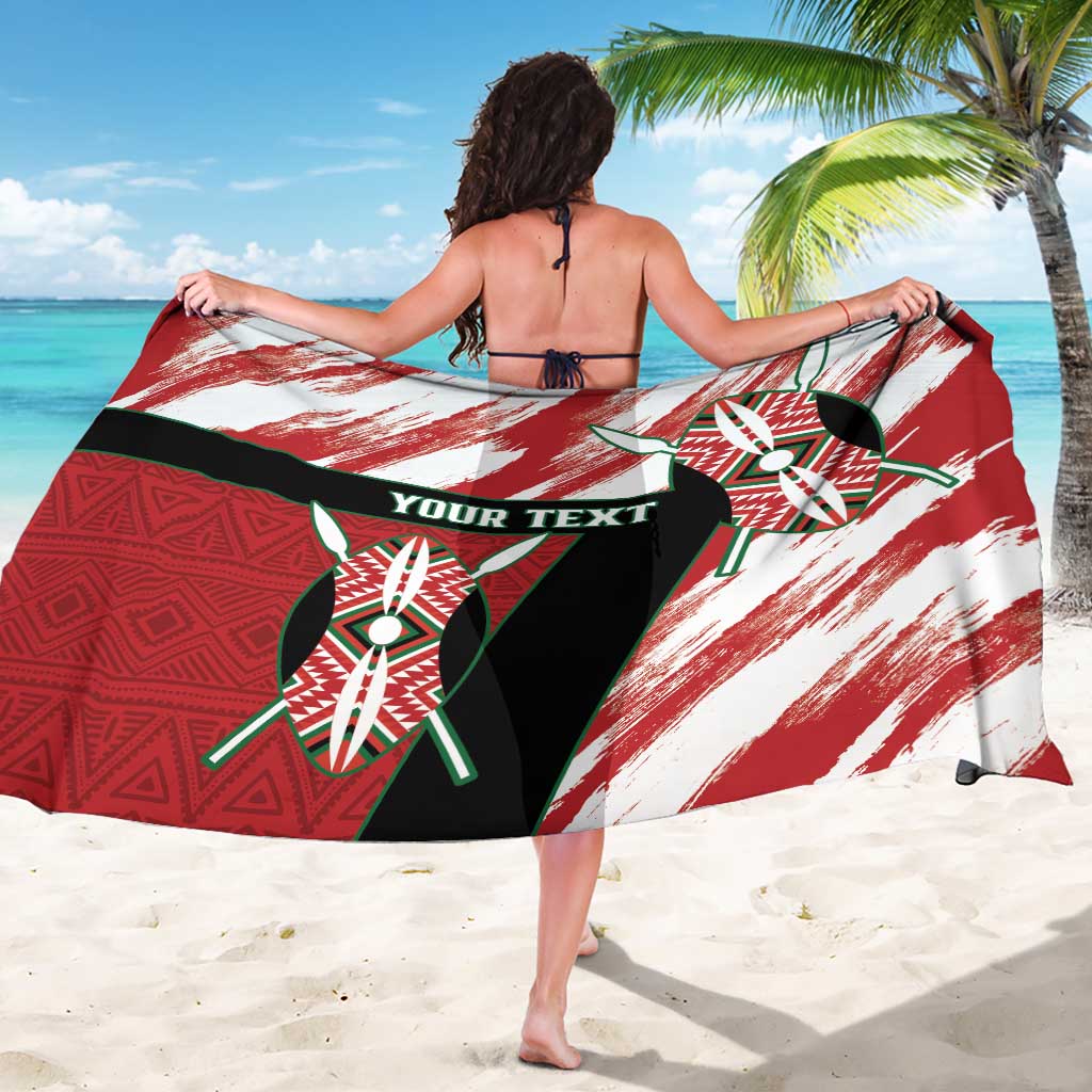 Red and white African-pattern sarong with black center graphic and 'YOUR TEXT' text