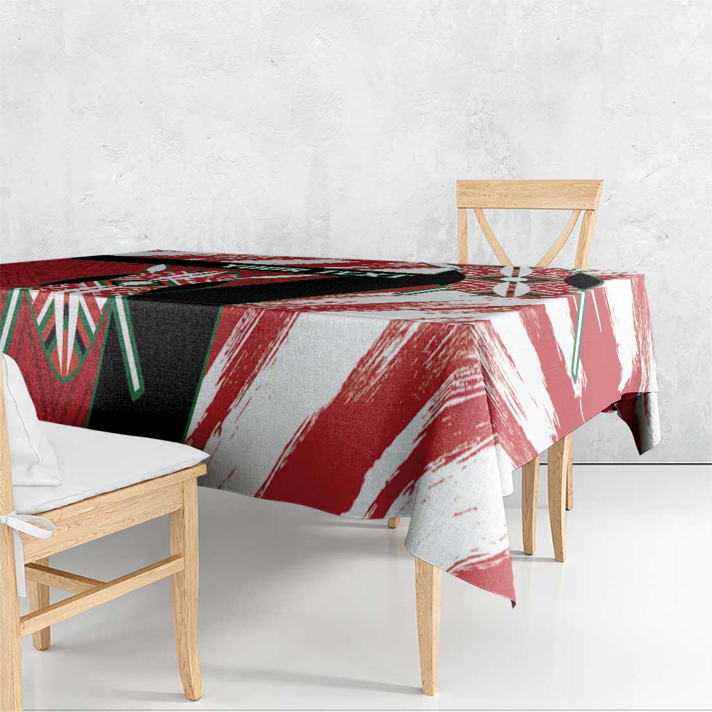 Kenya rugby tablecloth draped on bench, red and white brush stripes with black-green accents