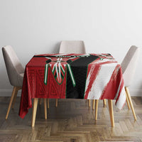 Kenya rugby sevens tablecloth on dining table, red white black with green spear-like shapes