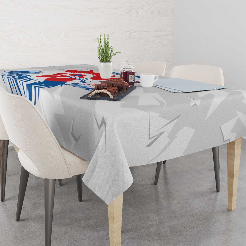 France rugby tablecloth draped on table, rooster graphic with 'Allez les Bleus' text