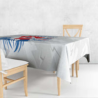 France rugby tablecloth corner view, blue and red rooster print on light gray geometric pattern