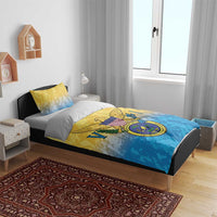 Yellow and blue comforter with Virgin Islands coat of arms crest, shown on bed