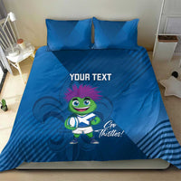 Blue duvet cover set with two pillows, thistle mascot artwork and 'YOUR TEXT' across center