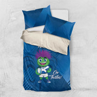 Blue duvet cover set with two pillows, green mascot holding a clover and 'YOUR TEXT'