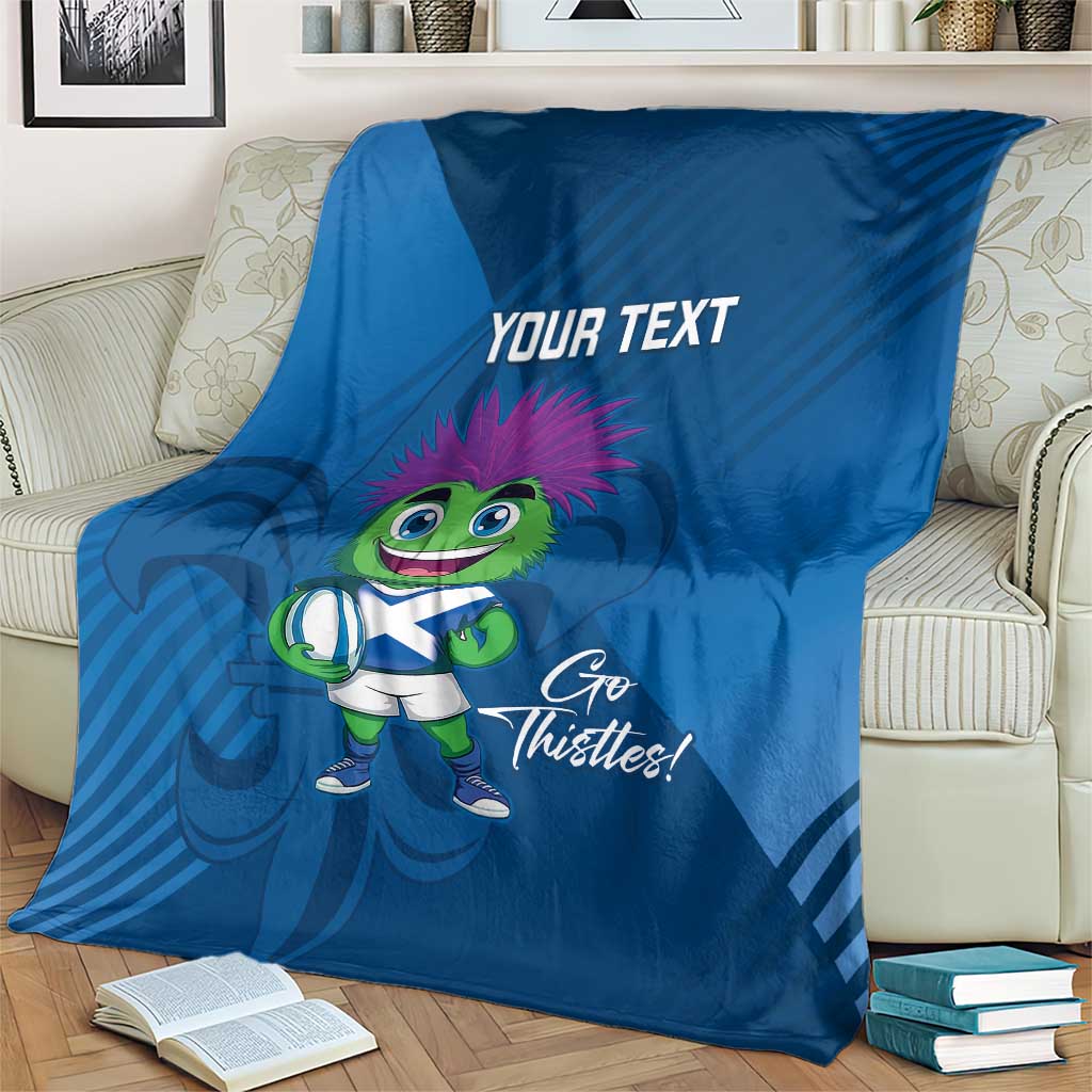 Blue rugby mascot blanket draped on armchair, 'Your Text' and 'Go Thistles!'