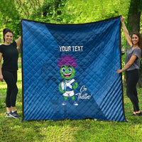 Blue quilt blanket outdoors with 'YOUR TEXT' and green thistle mascot graphic