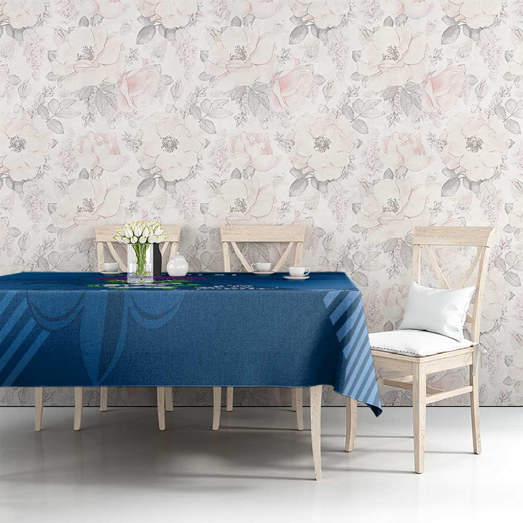 Blue tablecloth with thistle mascot and diagonal striped design on dining table
