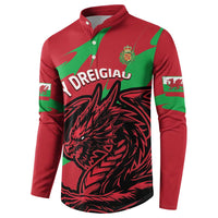 Red sweatshirt with green trim, black dragon chest print, and sleeve crest