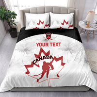 Canada hockey bedding set on bed: white duvet with black band and red maple leaf goalie art